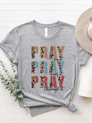 Gray graphic t-shirt with "PRAY" text in leopard print and solid colors, and "on it, over it, through it" text.