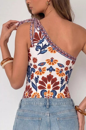 Vibrant floral one-shoulder bodysuit with tie straps and cutout detail.