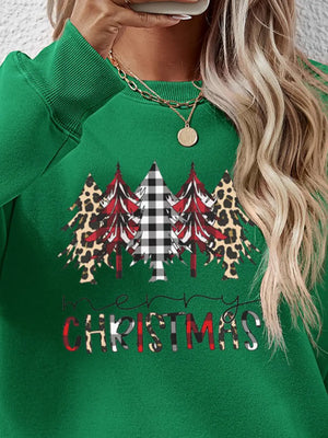 Green crewneck sweatshirt with Christmas trees and Merry Christmas graphic.