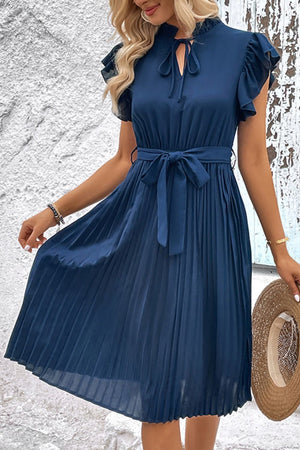 Deep teal midi dress with ruffled sleeves, tie neck, and pleated skirt.