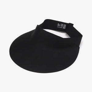 Black sculptural visor sun shield with adjustable band and care tag.