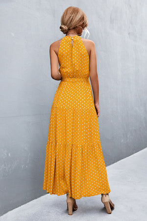 Yellow polka dot halter maxi dress with tiered skirt and tie waist