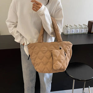 Quilted camel shopper tote bag with matching coin purse and silver chain detail.