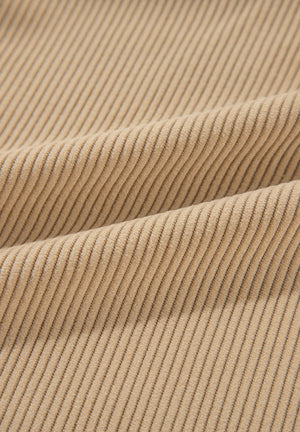 Tan corduroy utility shirt fabric detail with visible ridges.