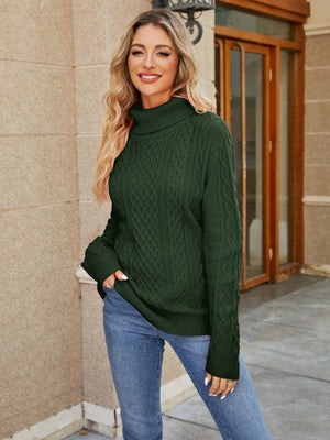 Green cable knit turtleneck sweater with a textured pattern.