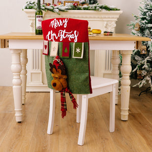 Christmas chair cover in red and green with reindeer applique and Merry Christmas text.