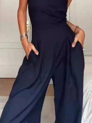 Dark blue strapless wide-leg maternity romper with pockets.