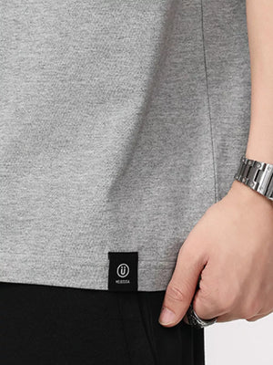 Grey cotton blend t-shirt with black logo tag detail on hem