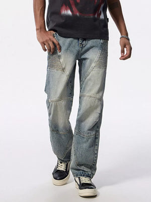 Men's light wash wide-leg moto jeans with textured knee panels and a relaxed fit.