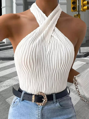 White wavy textured halter neck tank top with a crisscross neckline.