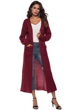 Burgundy longline knit cardigan with pockets and side slits, acrylic material.