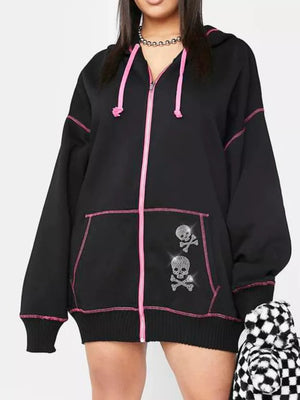 Black zip-up hoodie with pink contrast stitching and rhinestone skull graphics.