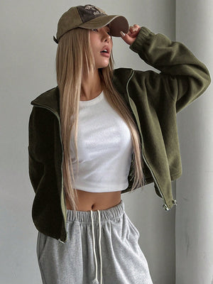 Olive fleece cropped funnel neck jacket with zipper closure, styled with a white crop top and grey sweatpants.