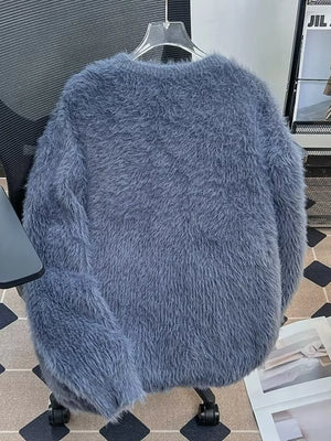 Blue fluffy knit pullover sweater with a soft, fuzzy texture.