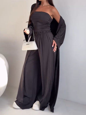 Dark brown three-piece outfit set with ruched strapless top, wide-leg pants, and long cardigan.