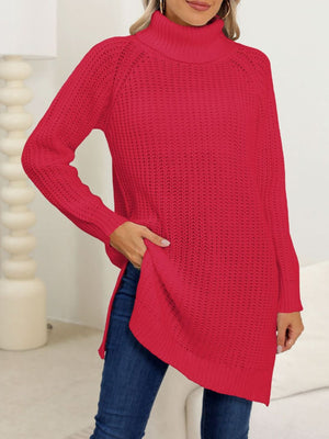 Scarlet knit turtleneck sweater with asymmetric hemline and side slits.