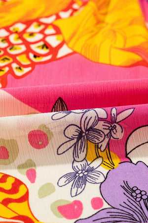 Patchwork floral print blouse in strawberry pink with blouson sleeves and a lightweight fabric.