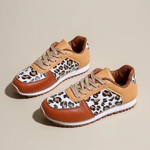 Leopard print panel sneakers in caramel and brown with lace-up closure.