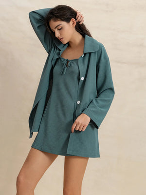 Textured mini dress and duster set in French Blue with tie-neck detail and white buttons.