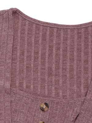 Sculpted ribbed button-front top in dusty pink with decorative buttons.