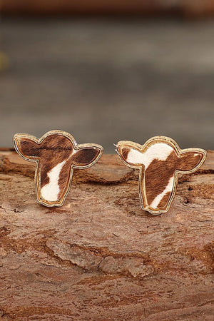 Cowhide silhouette stud earrings in copper with gold trim and natural cowhide pattern.