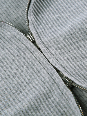 Grey ribbed knit hoodie detail with a silver zipper closure
