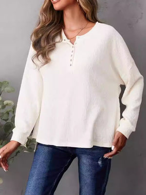 Ivory waffle knit henley shirt with button placket and side slits