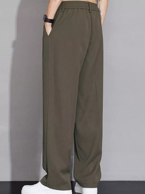 Men's wide-leg sweatpants in brown with elastic waist and pockets.