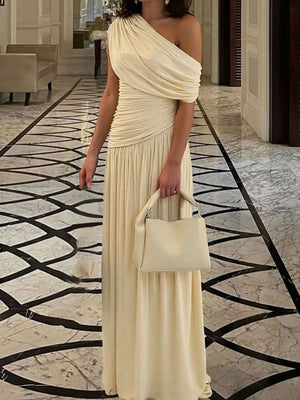 Elegant beige one-shoulder maxi dress with draped bodice and ruching.