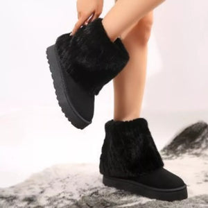 Black faux fur platform ankle boots with a cozy knit cuff detail.
