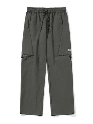 Gray cargo pants with zip-off legs and drawstring waist.