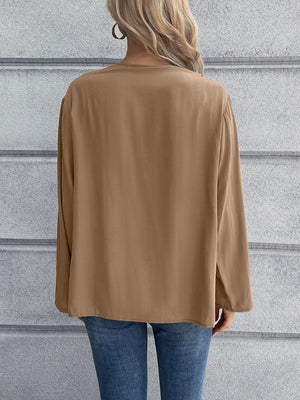 Camel long sleeve button-down blouse with mandarin collar, shown from the back.