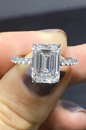 Sparkle Luxe Moissanite Halo Ring in silver with emerald-cut center stone and diamond band.