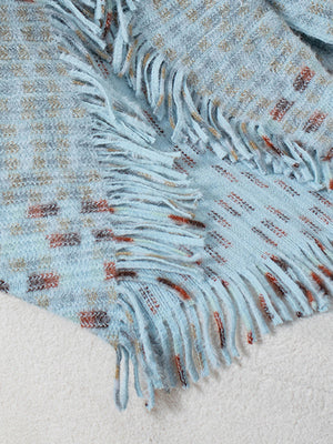 Light blue acrylic shawl cardigan with textured pattern and fringe details