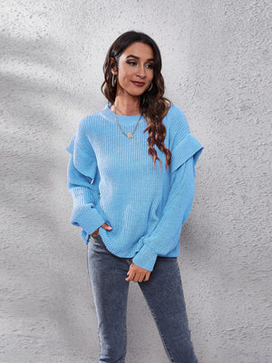 Pastel blue ribbed knit pullover sweater with ruffled sleeves and crew neck.