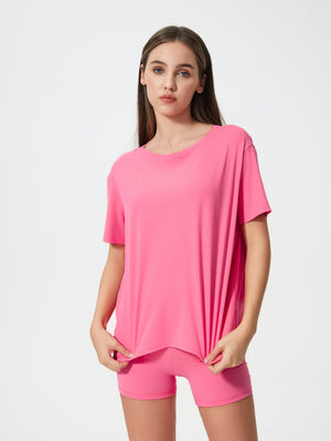 Relaxed fit performance tee in Fuchsia Pink with crew neck and short sleeves.