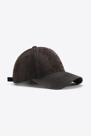 Distressed chestnut baseball cap with embroidered detail and adjustable strap