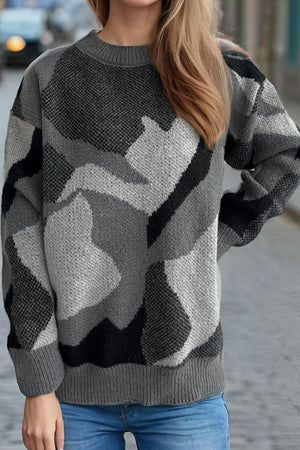 Geometric knit crewneck sweater in gray with colorblock pattern and ribbed trim.