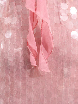 Pink iridescent sequin halter mini dress with ruffled trim detail.