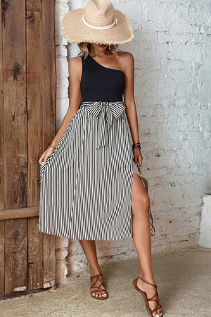 Black asymmetric stripe midi skirt with bow detail and thigh-high slit