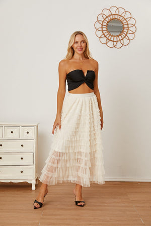 Tiered tulle maxi skirt in ivory with ruffled layers and a comfortable, flowy cut.