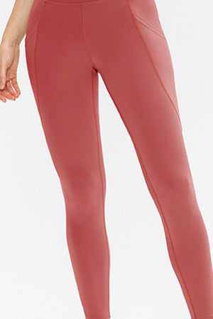 Watermelon pink performance leggings with sculpted pockets and breathable fabric.