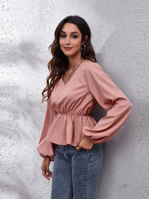 Dusty pink peplum blouse with V-neck and balloon sleeves
