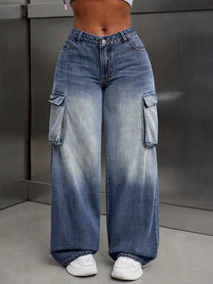 Vintage wide-leg cargo jeans in light wash denim with ombre fading and large side pockets.