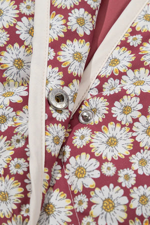 Burgundy daisy quilted jacket with stand collar and snap closures.