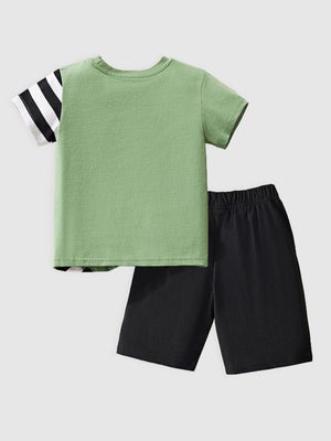 Toddler green cotton tee with black striped sleeves and black shorts.