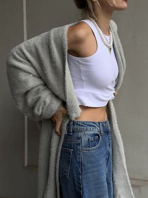 Light gray plush maxi cardigan with balloon sleeves, open front, worn with white tank and jeans.