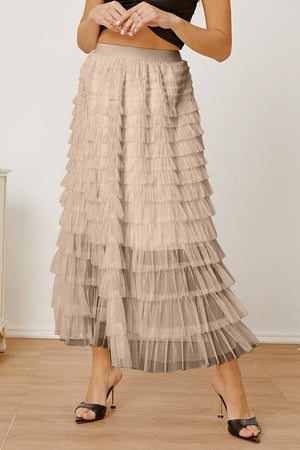 Tiered tulle maxi skirt in ivory with ruffled layers and a comfortable elastic waistband.