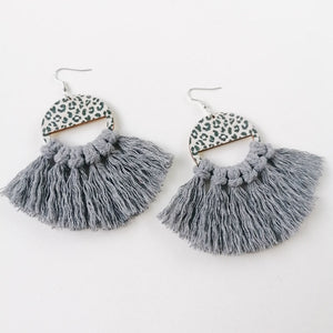 Leopard print fan earrings with dark gray tassels and wooden accents