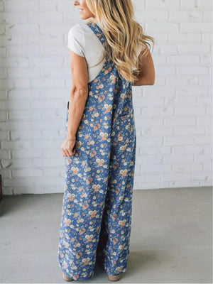Floral denim overalls with wide legs and adjustable straps, worn with a white tee.